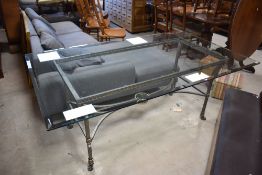 An Italian designer style glass top table with burnished metal frame and set of six (four plus