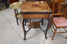 A Victorian envelope style card table having inlaid decoration and green baize top, approx width.