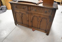 A mid 20th Century priory style sideboard, dimensions approx. H85 W125 D48cm
