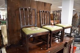 A set of six 19th Century mahogany rail back dining chairs having drop in seats , some being