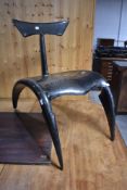 A modernist designer chair, constructing from carbon fibre in the Manta style, having inscription to