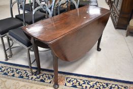 A 19th Century mahogany drop leaf dining table having oval top and cabriole gate legs, width approx.