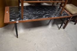 A vintage coffee table having marble effect inset top and dansette legs, approx. 125 x 46cm