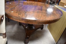 A William IV Rosewood pedestal table having circular top turned column and trefoil base, diameter