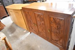 A Chinese sideboard , possibly camphorwood, having typical carved decoration, dimensions approx.