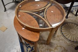 A vintage Mid Century G plan style teak 'Astro' set of glass top tables in the Nathan trinity design