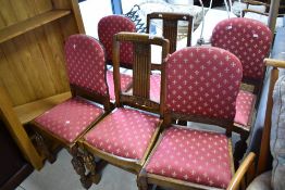 A harlequin set of six early 20th Century oak dining chairs
