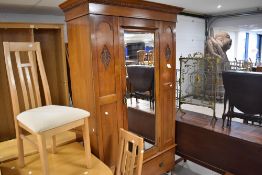A Victorian mahogany mirror door wardrobe having drawer base on turned legs, dimensions approx. H206