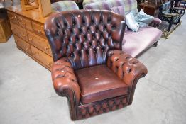 A Chesterfield style oxblood leather armchair with button back upholstery, width approx. 92cm