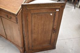 A late 19th or early 20th Century oak corner cupboard , height approx. 93cm