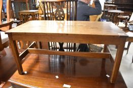 A vintage golden oak coffee table in the Arts and Crafts style, dimensions approx. 81.5 x 41 x 39cm