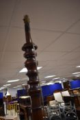 A late 19th or early 20th Century mahogany standard lamp having turned column and quadruple splay