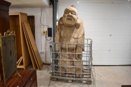 An impressive and monumental Chinese carved wooden Budai/laughing Buddha figure, modelled holding