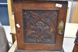 A Victorian oak cabinet having carved foliate and pokerwork decoration, possibly bathroom/