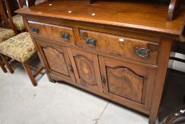 A late 19th or early 20th Century mahogany and walnut bookcase or display cabinet having inlaid