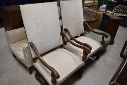 A pair of traditional (possibly 19th Century with later upholstery) scroll arm chairs in the 17th