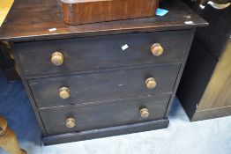 A traditional dark stained pine chest of three long drawers, dimensions approx. W88cm D50cm H89cm (