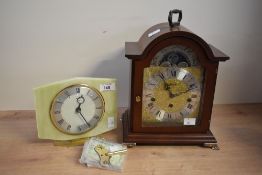 A 20th-century German Franz Hermle walnut cased mantel clock, featuring an 8-day Westminster Chime