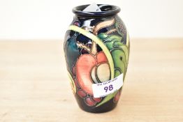 A small 20th-century Moorcroft Pottery 'Queen's Choice' vase by Emma Bossons, depicting tube lined
