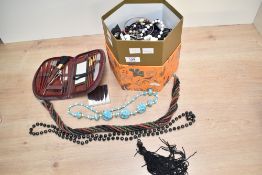 A large collection of costume jewellery, including bracelets, beaded jewellery, brooches and