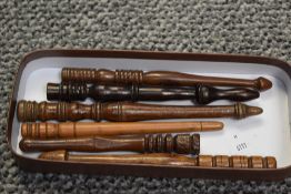 A selection of six 19th to 20th-century turned wood lace-making bobbins, of varying forms and woods,