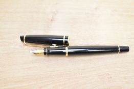 A Waterman Expert cartridge fill fountain pen in Black with gold trim having Waterman France M nib