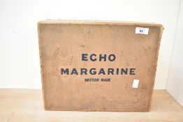 A vintage Echo Margarine cardboard advertising box, empty, marked to front and reverse, 34cm x 27cm,