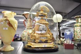 A 19th-century French Henri Marc ormolu and porcelain mantel clock, having an ornate pinecone finial