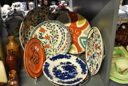 A selection of colourful 19th and 20th-century decorative ceramic plates, to include two hand