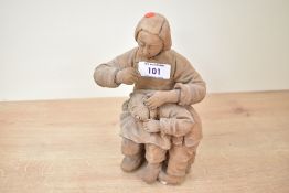 A 20th-century Chinese hand formed terracotta sculpture depicting a mother and child dressed in