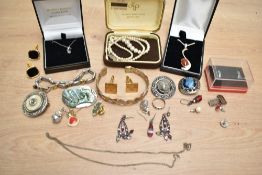A collection of costume jewellery, including a white metal carnelian set necklace, faux pearls and