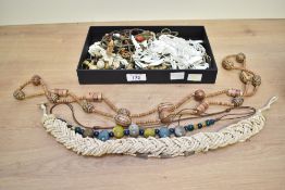 A collection of costume jewellery, including statement pieces, shell jewellery and beaded necklaces