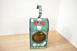 A 20th-century hand painted metal bargeware railway signalling lantern, featuring colourful floral