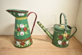 Two 20th-century traditional metal bargeware watering can and ewer, both featuring colourful