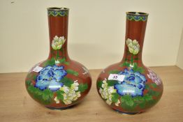 Two 20th-century Chinese cloisonne mantel vases, featuring floral and foliate motifs, having a
