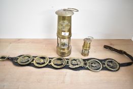 Two 19th to 20th-century Welsh brass miners’ safety lamps, to include a larger E. Thomas &