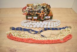 A collection of costume jewellery, including faux branch coral, wooden pieces, beaded jewellery