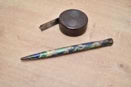 Two 20th-century Bakelite items including one tape measure and one knitting needle, smooth marbled