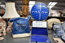 A mid 20th-century Pan Am Airlines blue metal and acrylic illuminating Reservations and