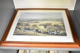 A mid to late 20th-century framed landscape print, depicting a scene of rural life, featuring