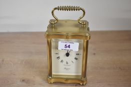A small late 20th-century Rapport London solid brass carriage clock, featuring a classic quartz