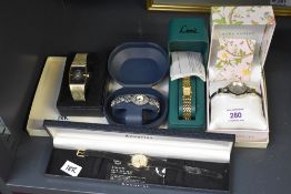 A group of five wristwatches, comprising Accurist, a marcasite set watch, and Laura Ashley