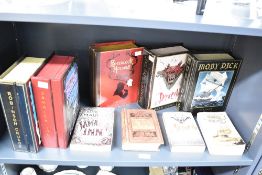 A group of five contemporary decorative hand-made and hand-painted book form boxes,to include Moby