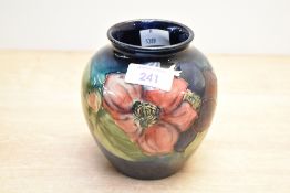 A small 20th-century Moorcroft Pottery 'Clematis' vase, featuring tube-lined floral decoration,