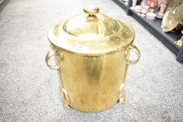 A large 19th/20th-century Art Nouveau brass coal/log bin, of cylindrical form with a removable