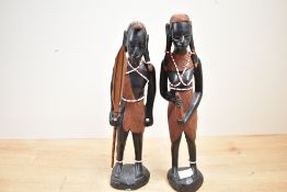 Two 20th-century African Tribal Art hand carved hardwood Maasai female and male warrior