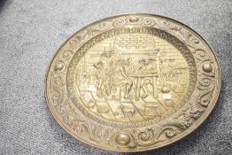 Two large decorative 20th-century brass decorative wall-hanging chargers, featuring two different