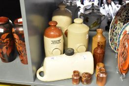 A selection of late 19th to early 20th-century stoneware, to include bed warmers, flagons, small
