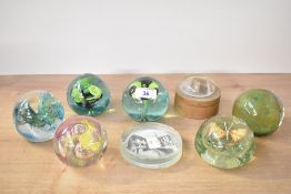 A quantity of 20th-century studio art glass paperweights, to include a Wedgewood example featuring