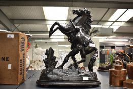 A 20th-century replica patinated bronze 'Marly Horses' sculpture after French artist Guillaume